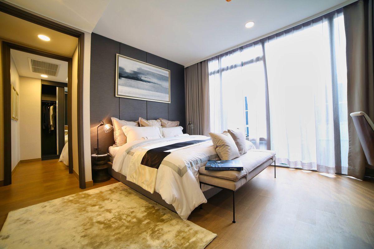 Thoughtfully styled guest room with warm textures